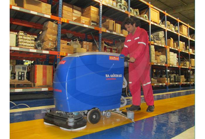 cleaning aisle in the warehouse with scrubber