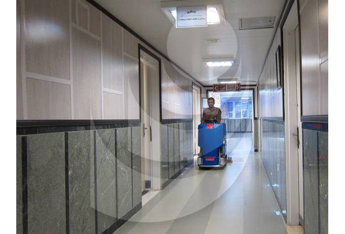 Cleaning corridors of the hospital with scrubber