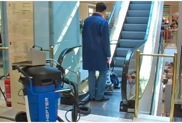 cleaning escalator by escalator cleaner machine